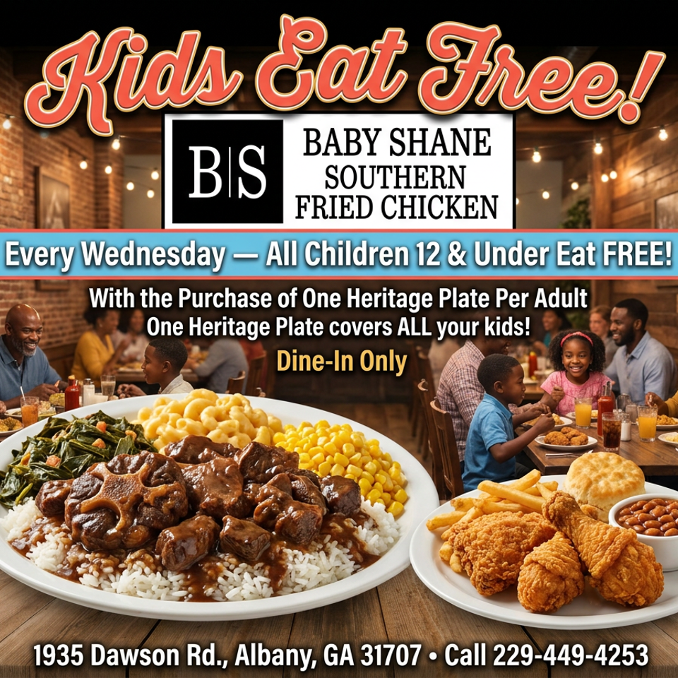 Plates of oxtails and fried chicken with sides, with families dining in the background.